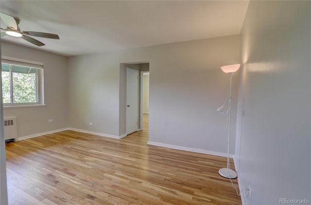 2100 N Franklin St Unit 8, Denver, CO 80205 - unfurnished room with radiator heating unit, a ceiling fan, light wood-style floors, and baseboards