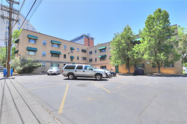 2100 N Franklin St Unit 8, Denver, CO 80205 - view of building exterior featuring uncovered parking