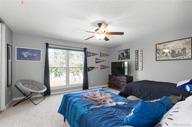 carpeted bedroom with a textured ceiling and ceiling fan