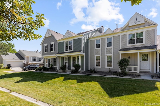 view of front of house featuring covered porch and a front yard