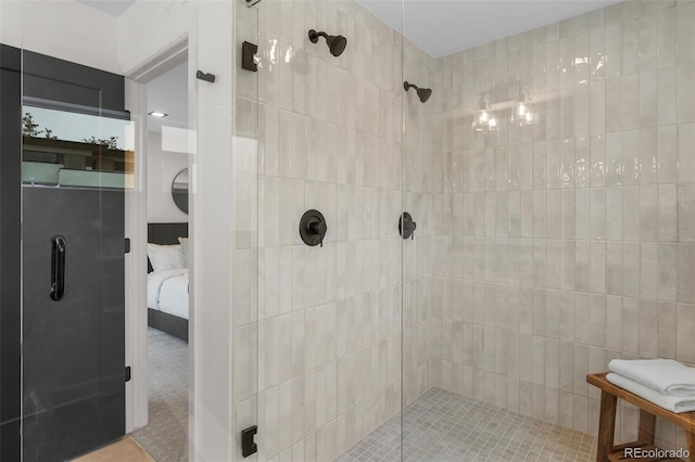 bathroom featuring a stall shower and ensuite bathroom