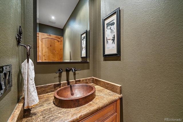 1456 Shavano Ct, Evergreen, CO 80439 - bathroom with a textured wall and vanity