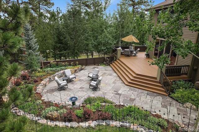 1456 Shavano Ct, Evergreen, CO 80439 - view of patio / terrace featuring outdoor dining space and a wooden deck