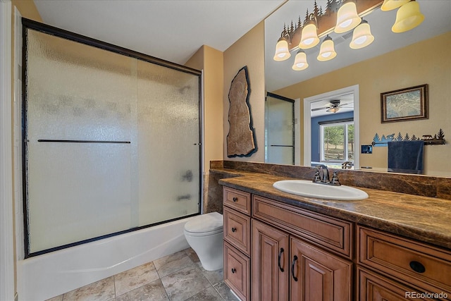 1456 Shavano Ct, Evergreen, CO 80439 - bathroom featuring vanity, bath / shower combo with glass door, tile patterned floors, and a ceiling fan