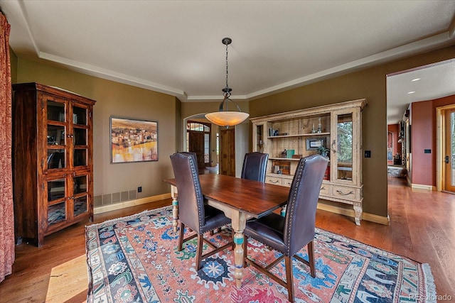 1456 Shavano Ct, Evergreen, CO 80439 - dining space with wood finished floors and arched walkways