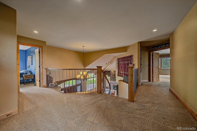 1456 Shavano Ct, Evergreen, CO 80439 - hallway with carpet floors, recessed lighting, and a chandelier
