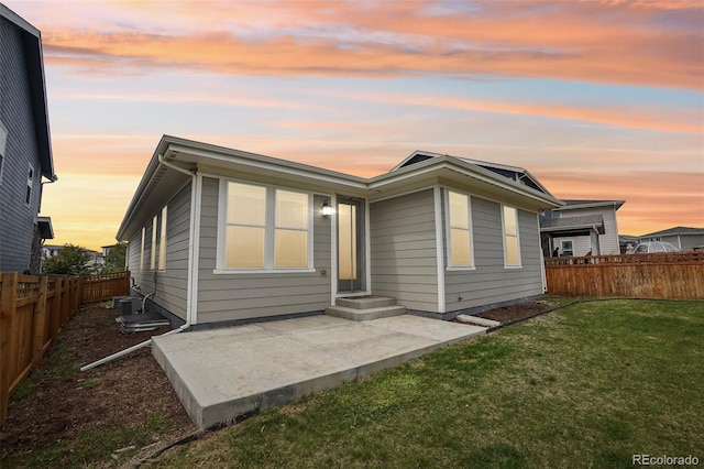 5928 N Odessa St, Aurora, CO 80019 - back of house at dusk featuring a patio area