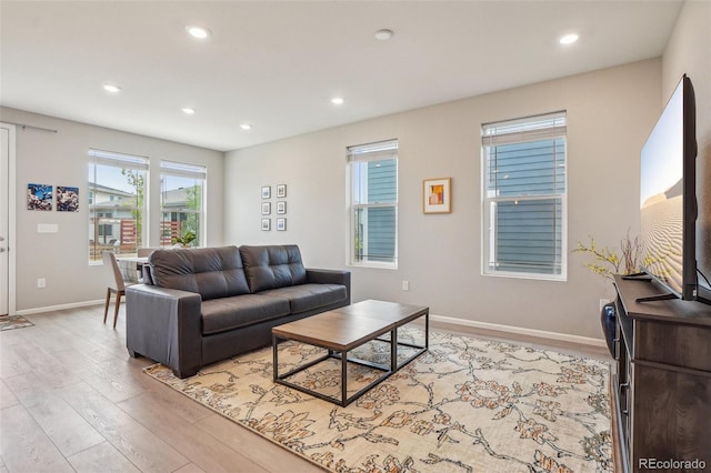 5928 N Odessa St, Aurora, CO 80019 - living area featuring light wood-type flooring, recessed lighting, and baseboards