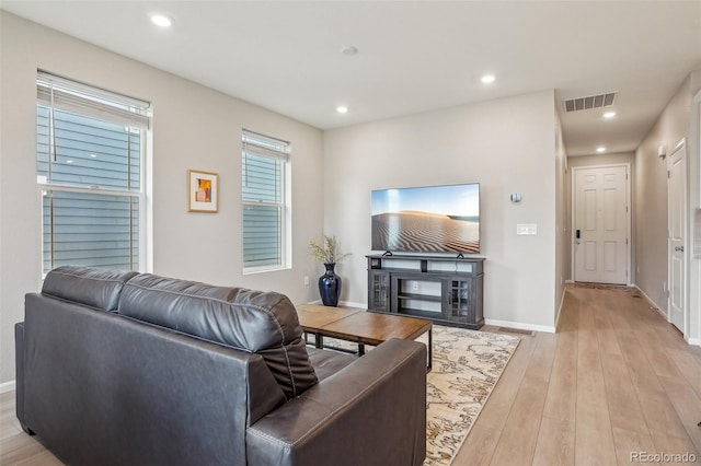 5928 N Odessa St, Aurora, CO 80019 - living room with light wood-type flooring, baseboards, and recessed lighting