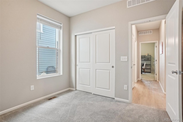 5928 N Odessa St, Aurora, CO 80019 - unfurnished bedroom with light carpet, baseboards, and a closet