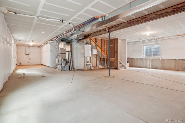5928 N Odessa St, Aurora, CO 80019 - basement with stairs, heating unit, and water heater