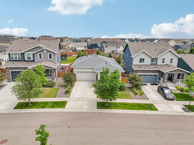 5928 N Odessa St, Aurora, CO 80019 - view of front of house with a residential view, concrete driveway, a garage, and board and batten siding