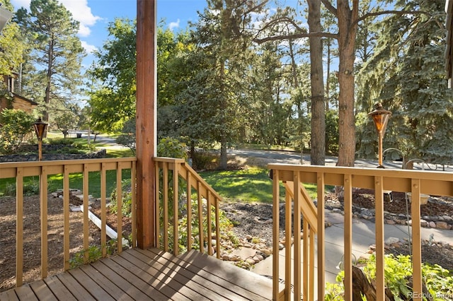 wooden deck with a yard