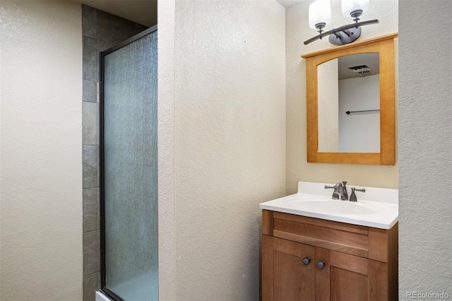 bathroom featuring vanity and walk in shower