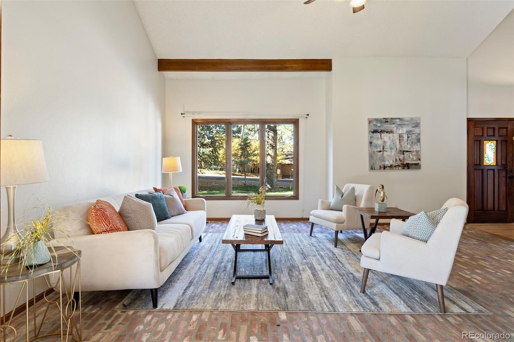 living room with ceiling fan, vaulted ceiling, and hardwood / wood-style flooring