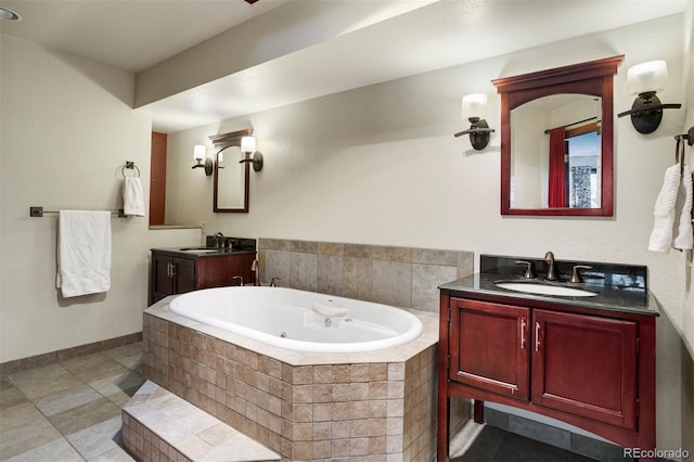 bathroom featuring tile patterned flooring, vanity, and a relaxing tiled tub