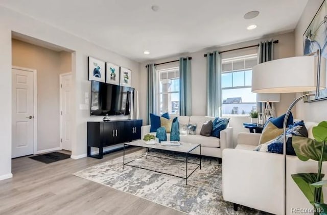 2094 Wagon Wheel Aly, Brighton, CO 80601 - living room featuring wood finished floors and recessed lighting
