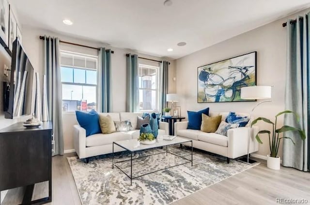 2094 Wagon Wheel Aly, Brighton, CO 80601 - living room featuring wood finished floors and recessed lighting