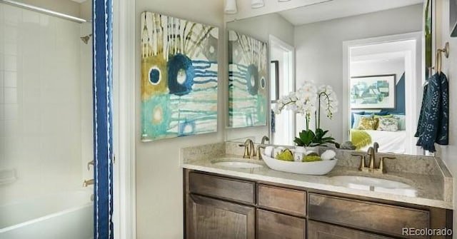 2094 Wagon Wheel Aly, Brighton, CO 80601 - bathroom with double vanity and shower / tub combination
