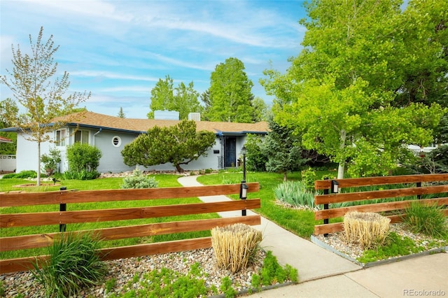 view of front of home with a front yard