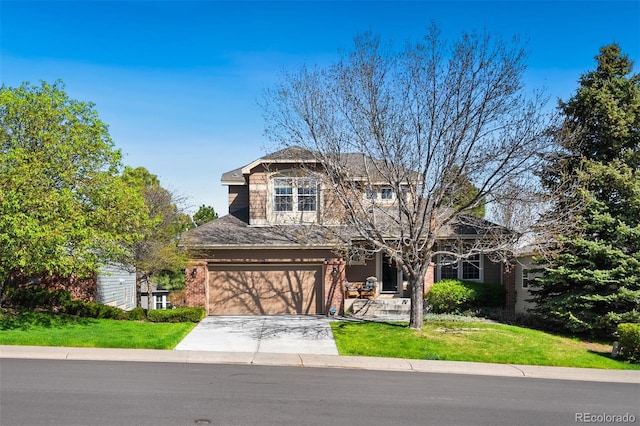 view of front facade featuring driveway, brick siding, a front lawn, and an attached garage