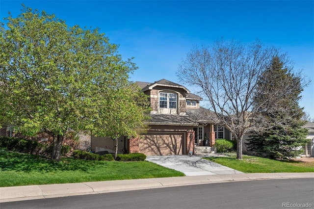 view of front of house with brick siding, driveway, a front yard, and an attached garage