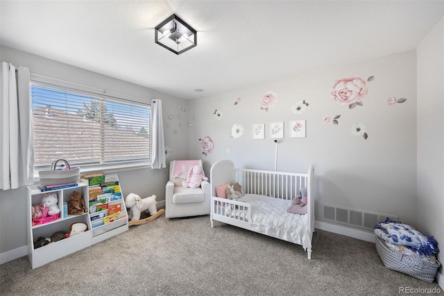 bedroom featuring carpet and baseboards
