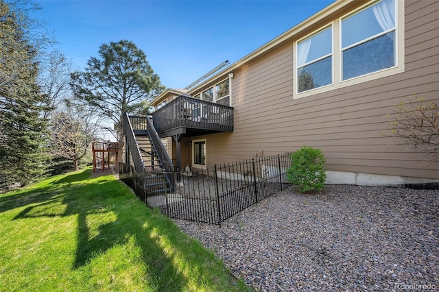rear view of house with a patio, stairs, and a wooden deck