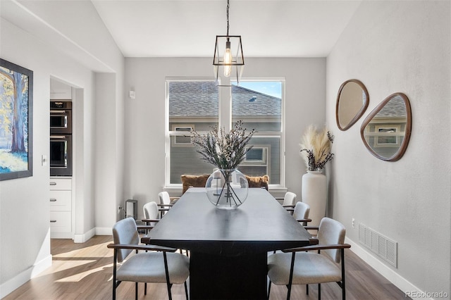 1053 Snow Lily Ct, Castle Pines, CO 80108 - dining space with wood finished floors and baseboards