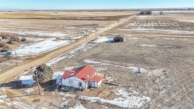 snowy aerial view featuring a rural view