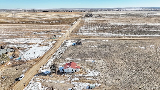 snowy aerial view with a rural view