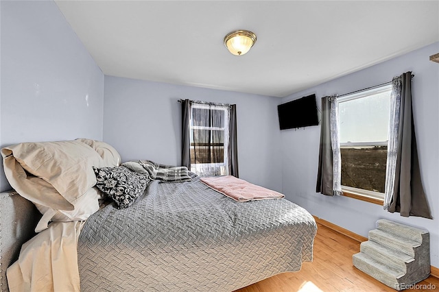 bedroom featuring light wood-style floors