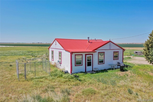 76000 E 168th Ave, Wiggins, CO 80654 - view of front of house featuring metal roof, fence, and a rural view