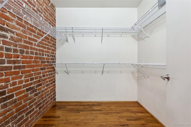 spacious closet with wood finished floors