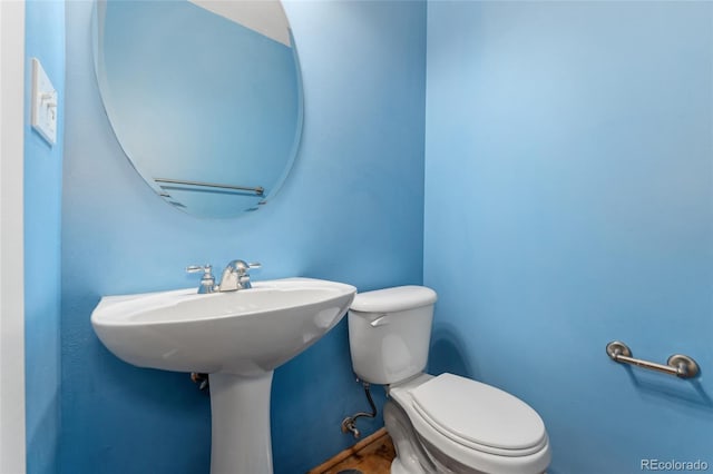 half bathroom with toilet