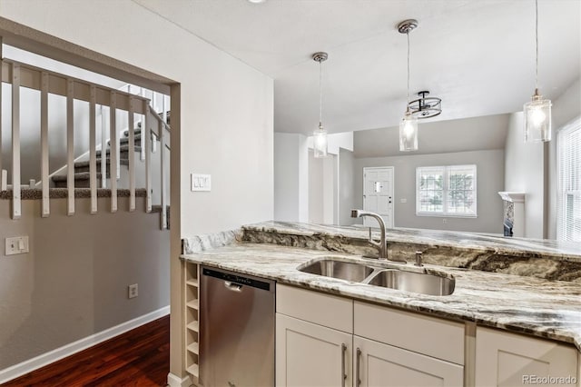 kitchen featuring a sink, decorative light fixtures, dishwasher, light stone counters, and dark wood-style flooring