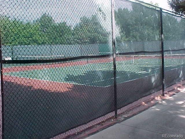 view of sport court with fence