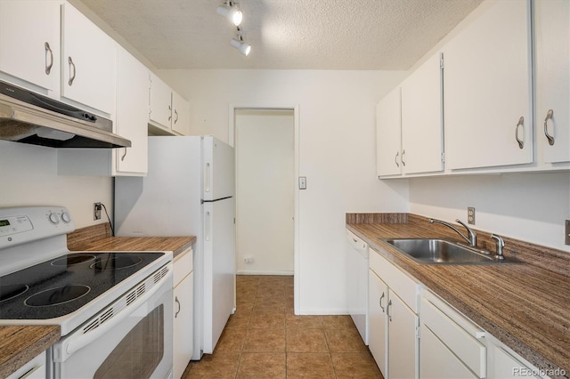 850 20th St Unit 203, Boulder, CO 80302 - kitchen with white appliances, under cabinet range hood, a sink, white cabinetry, and light tile patterned floors