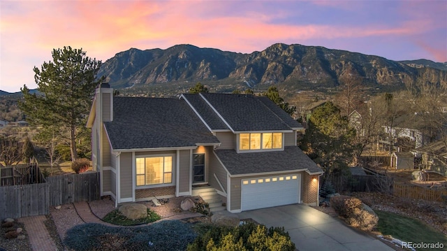 view of front of house featuring a garage and a mountain view