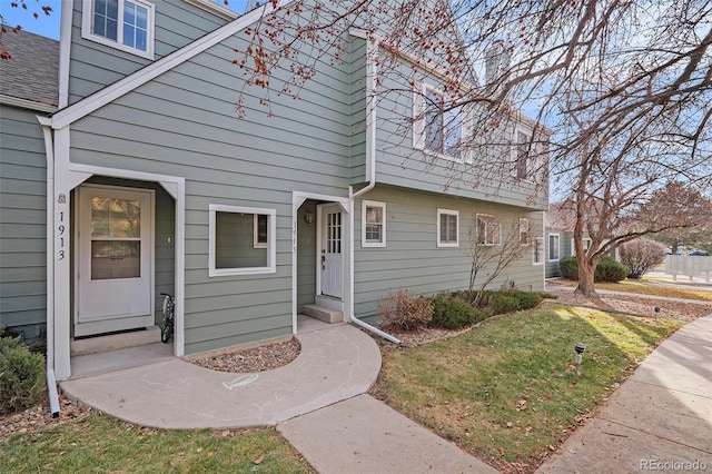 view of front of home with a front yard