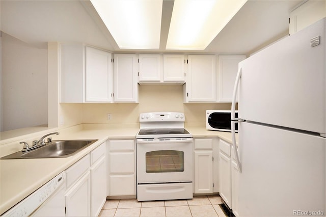 kitchen featuring light tile patterned floors, white appliances, white cabinetry, and sink