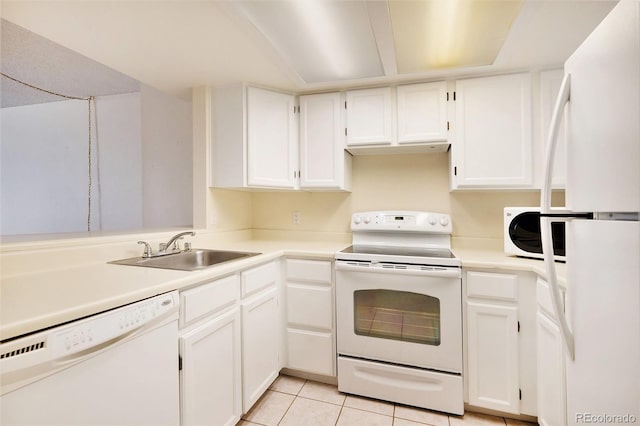 kitchen featuring white cabinetry, sink, light tile patterned floors, and white appliances