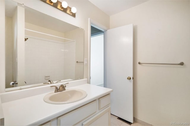 bathroom featuring tile patterned flooring and vanity