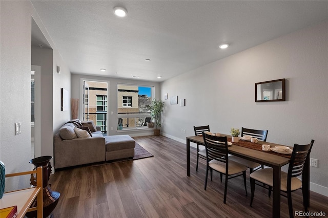 dining area featuring dark hardwood / wood-style floors