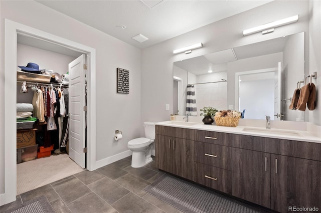 bathroom featuring vanity, toilet, and a shower with shower curtain