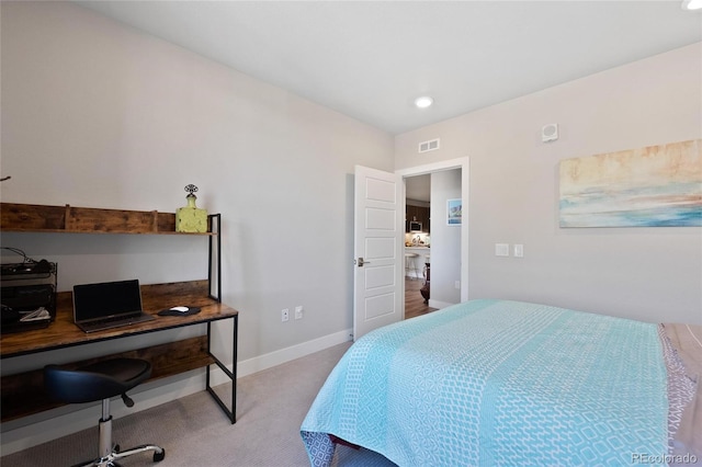 bedroom with light carpet