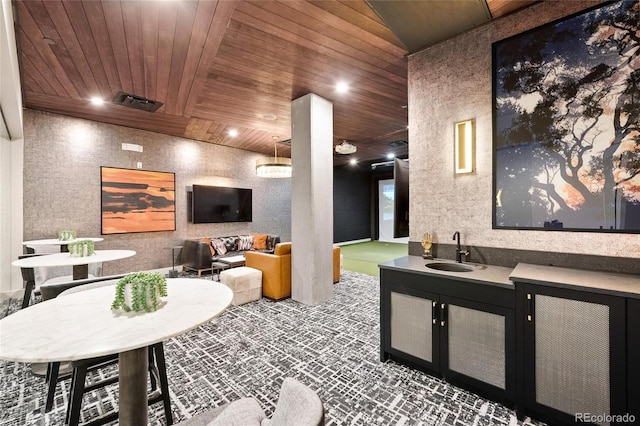 interior space with sink and wood ceiling