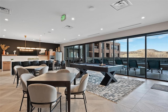 recreation room featuring light parquet floors, a mountain view, and billiards