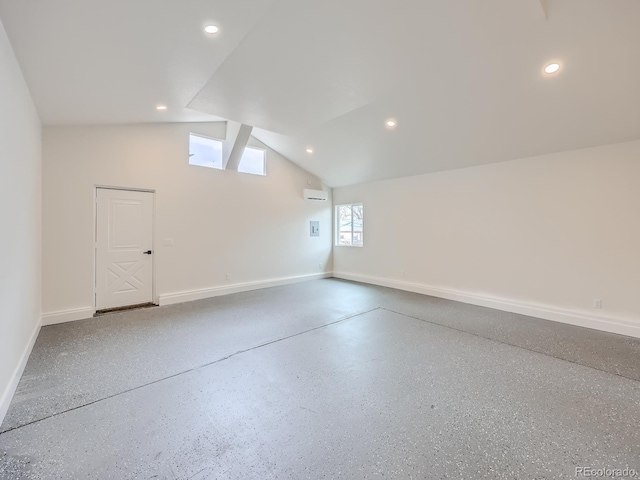 bonus room featuring a wall mounted AC and vaulted ceiling