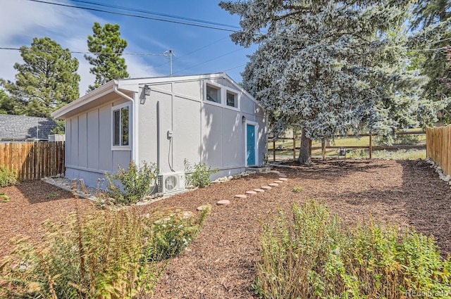 view of outbuilding featuring ac unit